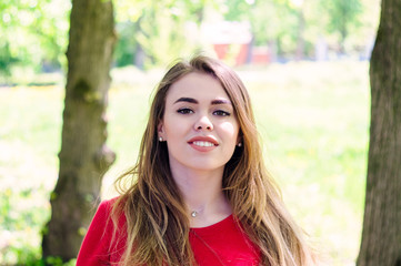 Fototapeta premium Portrait of a girl. dressed in a red jacket.
