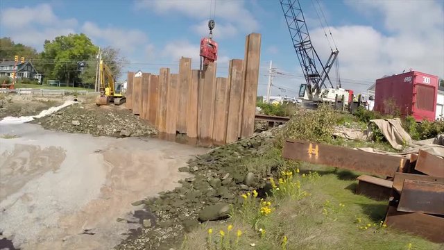 Construction of a cofferdam to keep the water level rising so a new bridge can be built