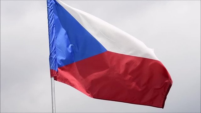 The flag of the Czech Republic waves in the wind in slow motion.