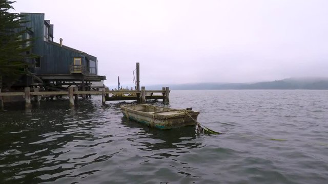 10 minute timelapse of a boat, deck, and calm waters. Shot on a cloudy day.
