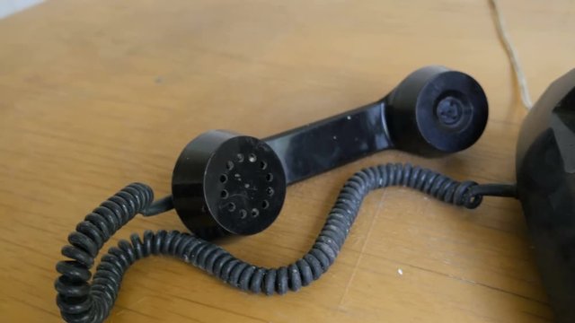 Old dusty, rusty landline phone.
