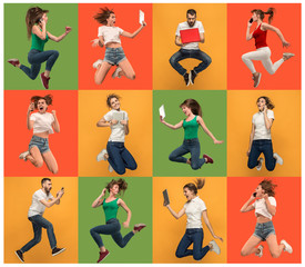 Businesswomen with laptop and jumping man and woman. Love to computer concept. Attractive female half-length front portrait, trendy studio backgroud. Young afro emotional woman. Human emotions