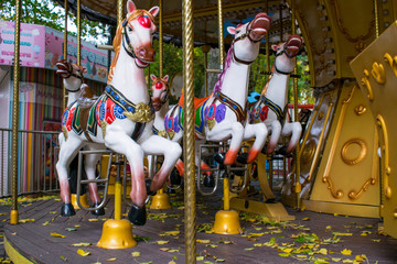 Children's carousel in the autumn.