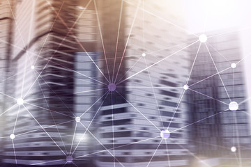 Blockchain network on blurred skyscrapers background. Financial technology and communication concept.