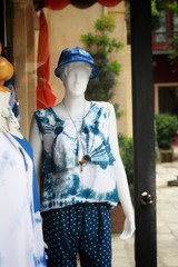 woman clothes model in front of the clothes shop