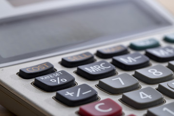 Close-Up Of Old Dirty Calculator On Table