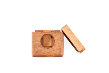 A wooden puzzle is a cube. Isolated on white background. Close-up.