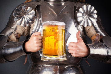 knight wearing armor and holding mug of beer