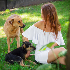 Young beautiful girl with a dog.