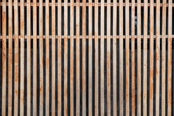 Modern wooden brown lath decoration on facade