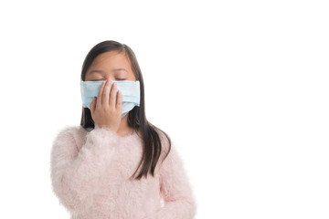 Asian kid girl age 7 years with protection mask against flu virus