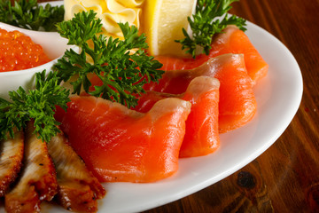 Trout fillet, red caviar and eel