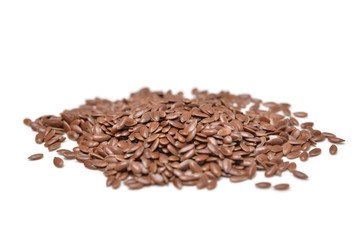 Brown flaxseeds  on white background - isolated