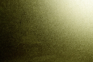 Ground glass texture in gold color with light in corner