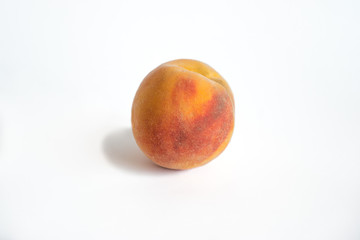 Fresh peach on a white background
