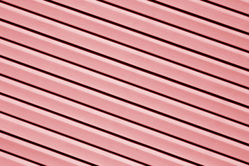 Plastic siding surface in red color.