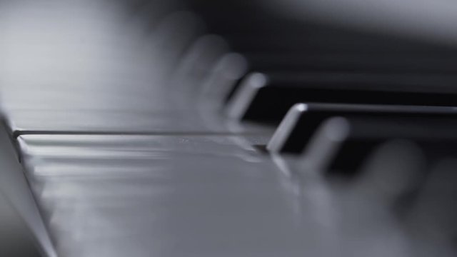 Musician playing on piano by one finger