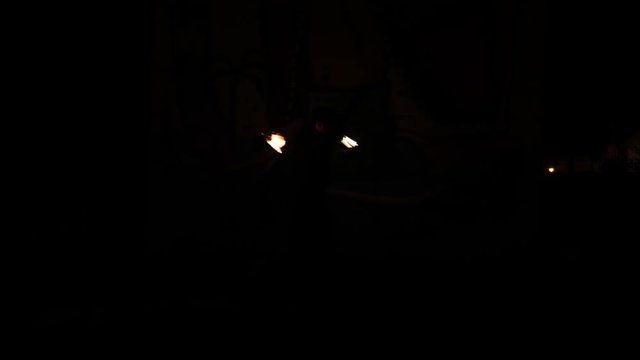 A Fire Juggler Make Some Trick With Fire Poi In The Dark, Graffiti Background3