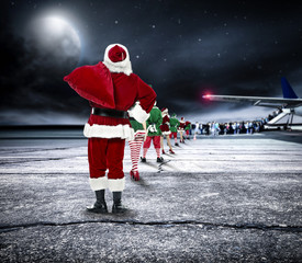 Santa Claus and winter night on Airport. 