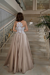 Fototapeta premium Beautiful bride in wedding dress near window