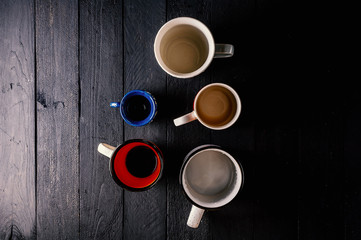 Obraz na płótnie Canvas Dirty cups on dark wooden table