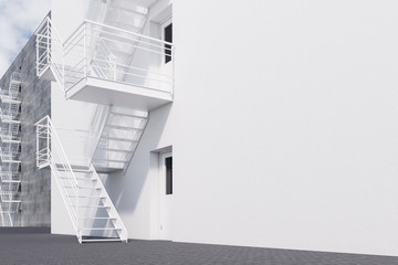 White building with fire escape ladder side view