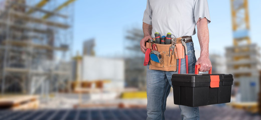 Building worker with tool belt