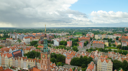 City of Gdansk in Poland, aerial view over the Old Town, view from Saint Mary's Church Tower. Cityscape of Gdansk at summer cloudy day.