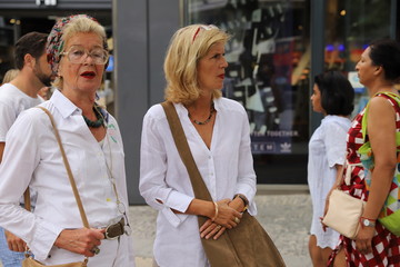 Adult daughter with her mother during shopping at Kurfürstendamm and Tauentzienstraße in Berlin-City, Germany.