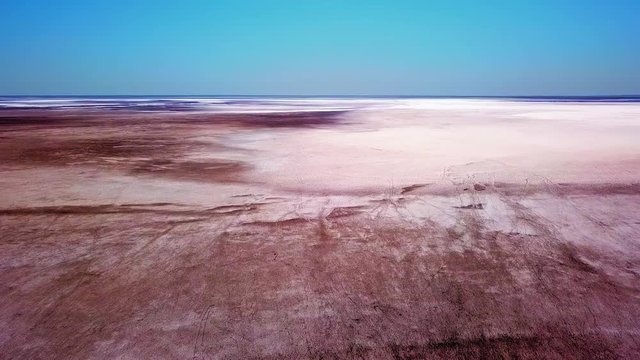 Slow tracking shot over Lake Eyre salt lake in outback South Australia. Very remote area and the lowest natural point in Australia.
