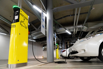 Electric cars are charged at the charging station in the underground parking lot