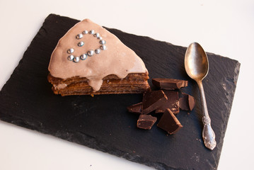 Sweet surprise for darling. Piece of chocolate cake with heart.