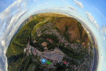 Helicopter drone shot. Aerial photography of a modern city over an area, a large crossroads,...