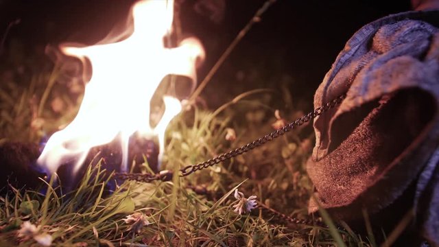 Superslow, A Fire Juggler Cleans Hist Fire Pois Chains