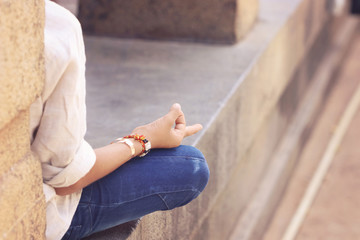 Indian young boy meditating at hindu temple