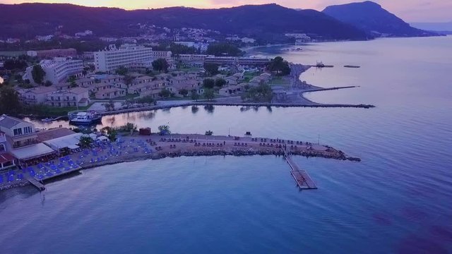 Greece, Corfu Island, drone footage of a beautiful sunset over Messonghi Beach. Rise Shot