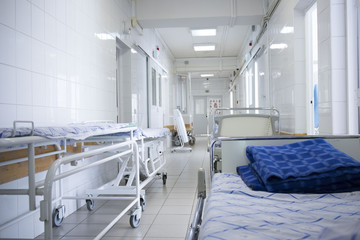 hospital bed rolling into the hallway of the hospital