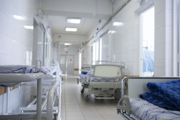 hospital bed rolling into the hallway of the hospital