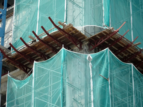 Catch platform or other construction projection from the face of a building. It is protect individuals and property from falling debris during construction. 