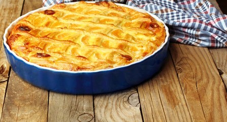 Cheese cake with tangerine.In blue baking tray. Cheese pie.Desert .Homemade.Rustic background.copy space