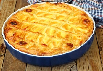 Cheese cake with tangerine.In blue baking tray. Cheese pie.Desert .Homemade.Rustic background