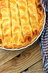 Cheese cake with tangerine.In blue baking tray. Cheese pie.Desert .Homemade.Rustic background.copy space