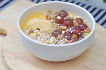 mango yogurt with apple, oat, pistachio and grape