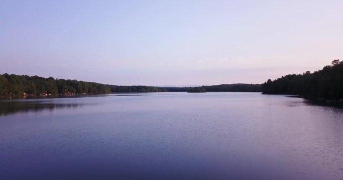 AERIAL: Drone fly over lake during sunset