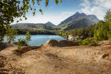 Beautiful forest mountain road near the blue lake