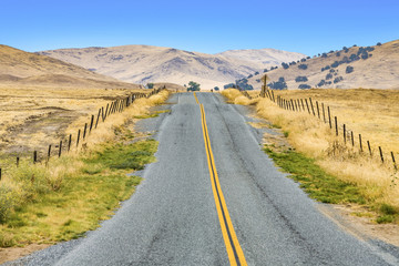 small street near exeter in the contryside with nice meadows,  grass and lovely hills
