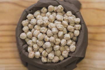 Bowl of chickpeas on wooden board