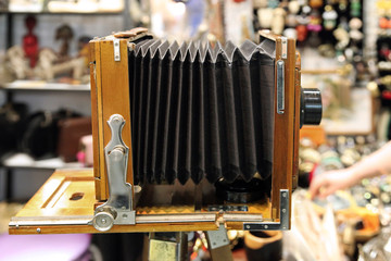 Vintage camera with an accordion at a flea market. Moscow. 07.02.2018