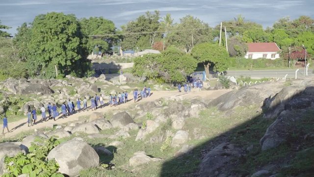 Tanzanian children, early in the morning on their way to school in Mwanza on Lake Victoria