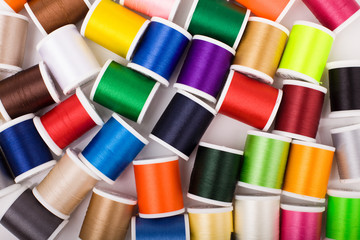 Colorful Sewing Threads on White Background